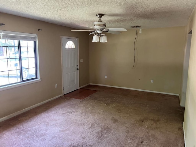1012 Box St, Altus, OK 73521 - carpeted entrance foyer with a ceiling fan, a textured ceiling, and baseboards