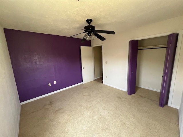1012 Box St, Altus, OK 73521 - unfurnished bedroom featuring carpet, baseboards, a closet, and ceiling fan