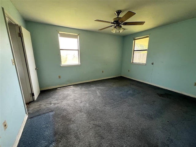 1012 Box St, Altus, OK 73521 - unfurnished bedroom with carpet floors, baseboards, and ceiling fan