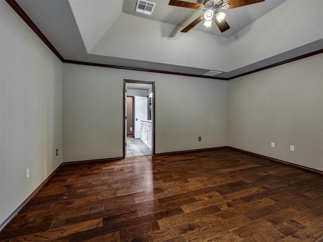 3605 SW Wayfield Ave, Oklahoma City, OK 73132 - spare room featuring a ceiling fan, wood finished floors, crown molding, baseboards, and a raised ceiling