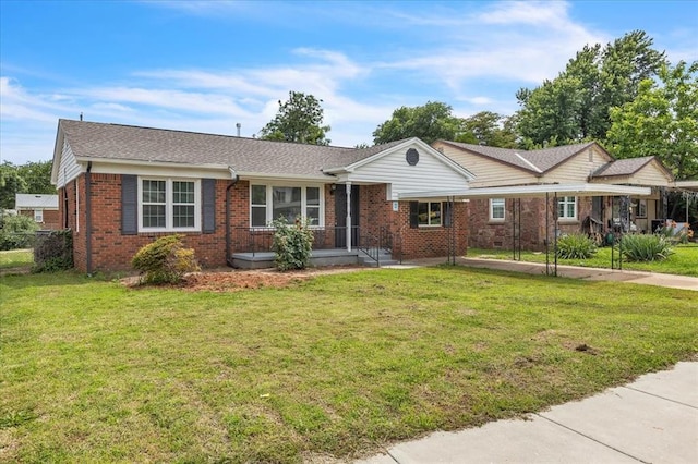 724 SW 48th St, Oklahoma City, OK 73109 - ranch-style house featuring brick siding, a front yard, a carport, and roof with shingles