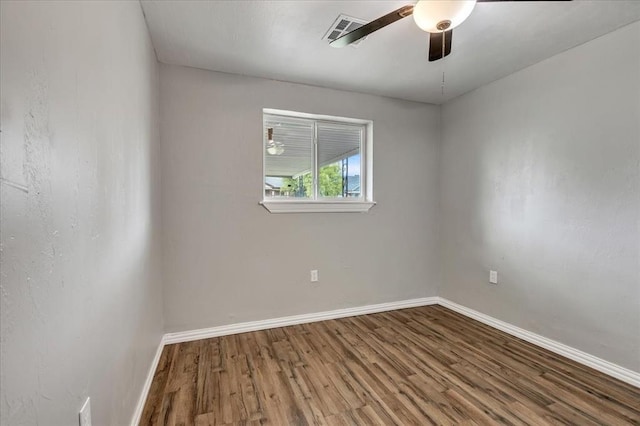 724 SW 48th St, Oklahoma City, OK 73109 - spare room featuring wood finished floors, baseboards, and ceiling fan