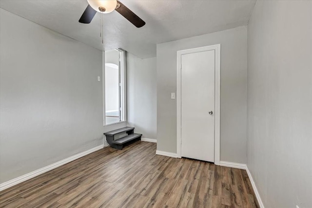 724 SW 48th St, Oklahoma City, OK 73109 - unfurnished room featuring wood finished floors, ceiling fan, and baseboards