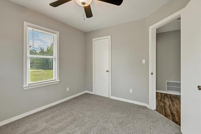 724 SW 48th St, Oklahoma City, OK 73109 - unfurnished bedroom with baseboards, carpet floors, and a ceiling fan