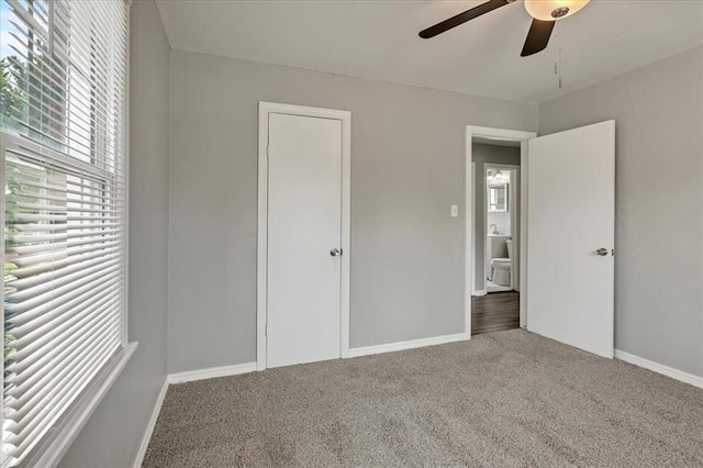 724 SW 48th St, Oklahoma City, OK 73109 - unfurnished bedroom featuring carpet floors, baseboards, and a ceiling fan