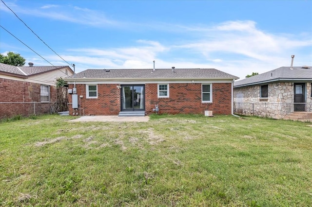 724 SW 48th St, Oklahoma City, OK 73109 - back of property with brick siding, a patio, entry steps, and roof with shingles