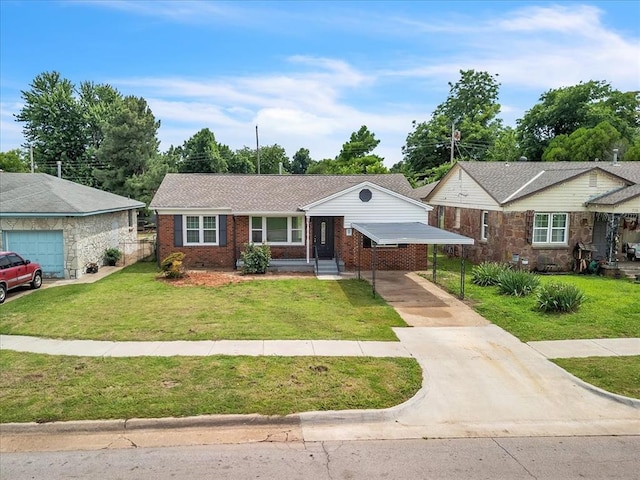 724 SW 48th St, Oklahoma City, OK 73109 - ranch-style house with concrete driveway, brick siding, a front yard, and a carport