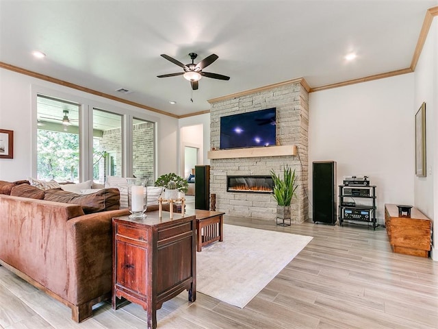 13001 Broken Arrow, Arcadia, OK 73007 - living area featuring ornamental molding, a ceiling fan, a stone fireplace, and wood finished floors