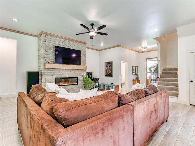 13001 Broken Arrow, Arcadia, OK 73007 - living area featuring light wood-style floors, a ceiling fan, baseboards, stairs, and ornamental molding