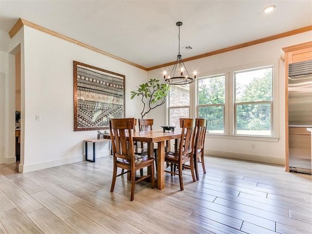 13001 Broken Arrow, Arcadia, OK 73007 - dining room with a chandelier, crown molding, baseboards, and light wood-style floors