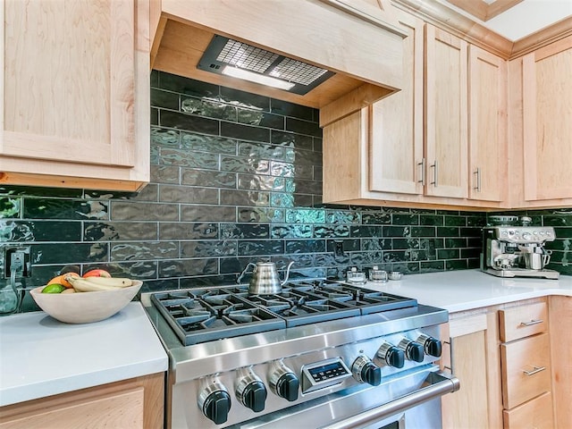 13001 Broken Arrow, Arcadia, OK 73007 - kitchen with stainless steel range, light brown cabinetry, tasteful backsplash, light countertops, and exhaust hood