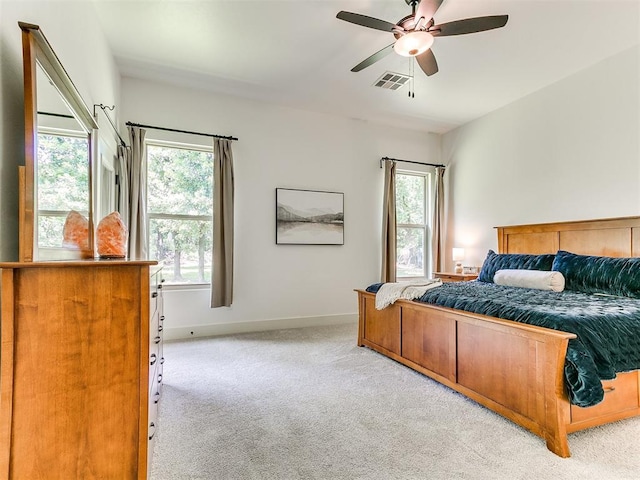 13001 Broken Arrow, Arcadia, OK 73007 - bedroom featuring carpet, multiple windows, baseboards, and ceiling fan