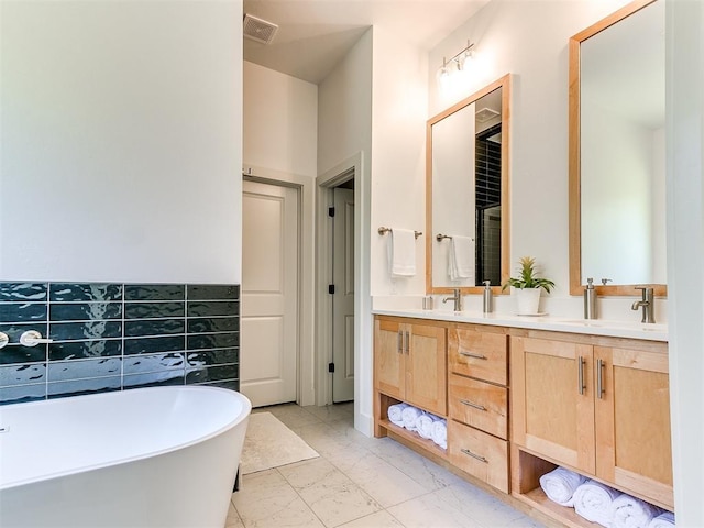 13001 Broken Arrow, Arcadia, OK 73007 - bathroom featuring double vanity, a freestanding bath, and marble finish floors