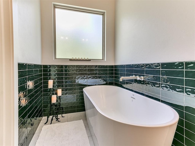 13001 Broken Arrow, Arcadia, OK 73007 - full bathroom with tile walls, a soaking tub, and wainscoting