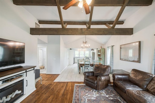 4120 SE 112th St, Moore, OK 73160 - living area with ceiling fan, a chandelier, dark wood-type flooring, beam ceiling, and baseboards