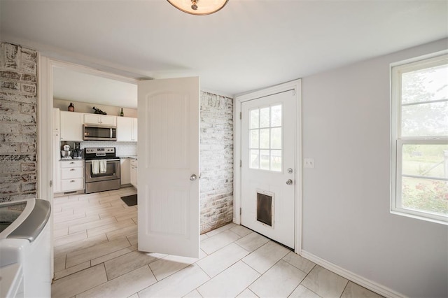 4120 SE 112th St, Moore, OK 73160 - kitchen with stainless steel appliances and white cabinetry