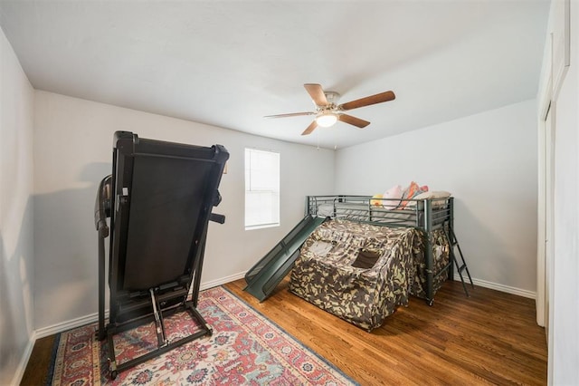 4120 SE 112th St, Moore, OK 73160 - bedroom featuring baseboards, wood finished floors, and a ceiling fan