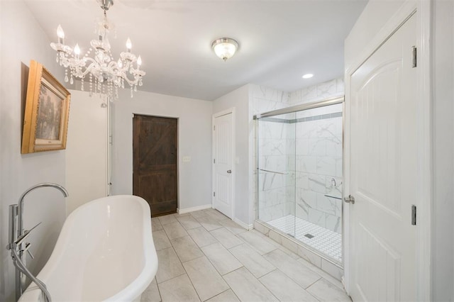 4120 SE 112th St, Moore, OK 73160 - bathroom with a soaking tub, a stall shower, a chandelier, baseboards, and marble finish flooring