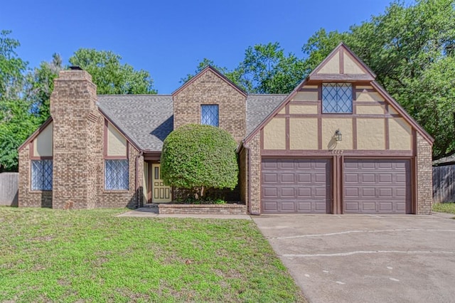 1117 Robin Hood Ln, Norman, OK 73072 - english style home with driveway, a chimney, a front lawn, a garage, and a shingled roof