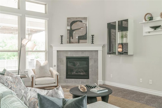 1417 Cordgrass Ct, Edmond, OK 73013 - carpeted living room with a tile fireplace and baseboards