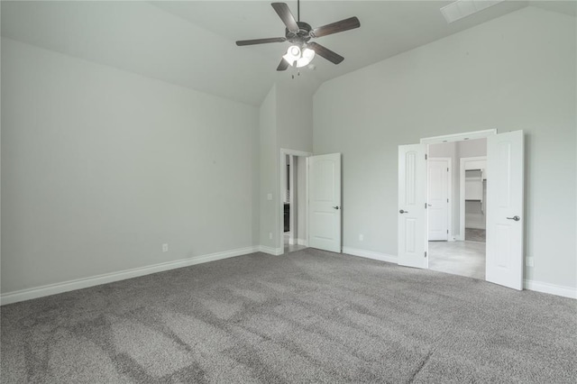 1417 Cordgrass Ct, Edmond, OK 73013 - unfurnished bedroom featuring high vaulted ceiling, carpet, baseboards, ceiling fan, and a walk in closet