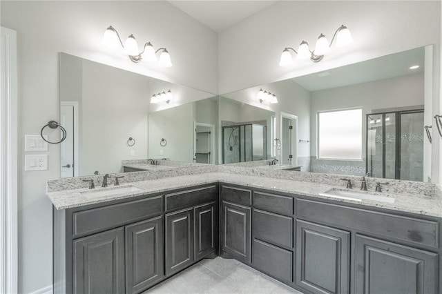 1417 Cordgrass Ct, Edmond, OK 73013 - full bathroom with a stall shower, double vanity, and tile patterned flooring