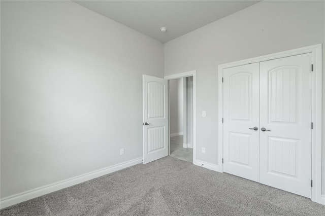 1417 Cordgrass Ct, Edmond, OK 73013 - unfurnished bedroom featuring carpet flooring, baseboards, and a closet