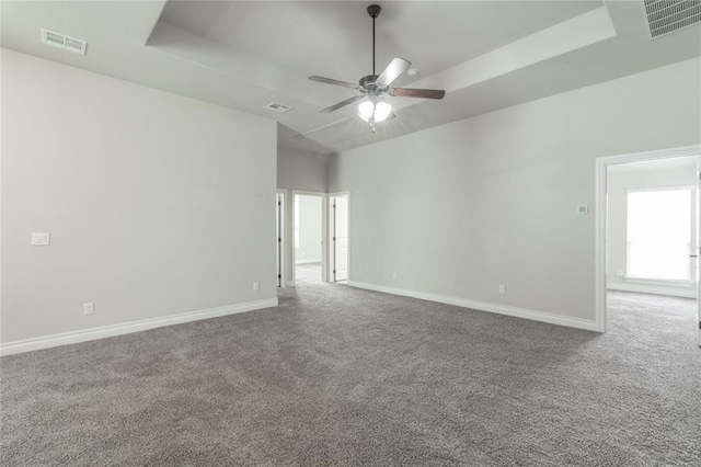 1417 Cordgrass Ct, Edmond, OK 73013 - carpeted spare room featuring ceiling fan, baseboards, and a raised ceiling