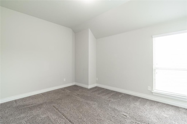 1417 Cordgrass Ct, Edmond, OK 73013 - spare room with carpet flooring, vaulted ceiling, baseboards, and healthy amount of natural light