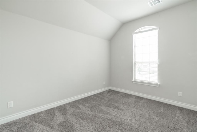 1417 Cordgrass Ct, Edmond, OK 73013 - additional living space featuring dark colored carpet, lofted ceiling, and baseboards