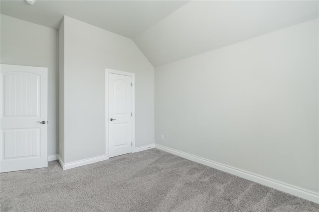 1417 Cordgrass Ct, Edmond, OK 73013 - bonus room featuring light carpet, baseboards, and lofted ceiling