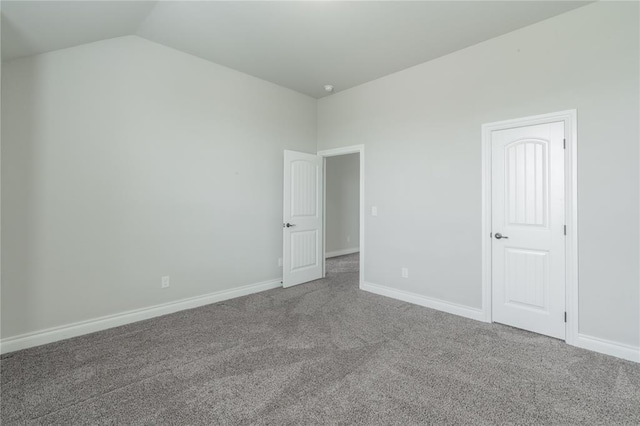 1417 Cordgrass Ct, Edmond, OK 73013 - unfurnished bedroom featuring carpet, vaulted ceiling, and baseboards