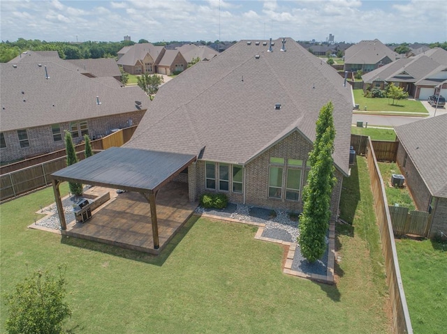 1417 Cordgrass Ct, Edmond, OK 73013 - back of house featuring a residential view, roof with shingles, a patio area, and brick siding