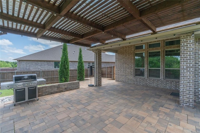 1417 Cordgrass Ct, Edmond, OK 73013 - fenced backyard with grilling area, a pergola, and a patio