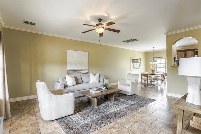 17504 Silverhawk Way, Edmond, OK 73012 - living area with a ceiling fan, baseboards, ornamental molding, and arched walkways