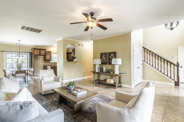 17504 Silverhawk Way, Edmond, OK 73012 - living room featuring ceiling fan, stairs, crown molding, baseboards, and light tile patterned floors