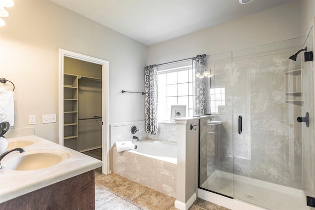 17504 Silverhawk Way, Edmond, OK 73012 - full bath with a bath, a shower stall, tile patterned flooring, a spacious closet, and double vanity
