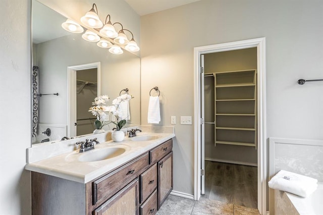 17504 Silverhawk Way, Edmond, OK 73012 - full bathroom featuring double vanity and a walk in closet