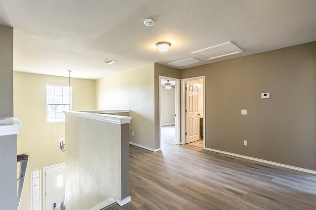 17504 Silverhawk Way, Edmond, OK 73012 - unfurnished room featuring wood finished floors and baseboards