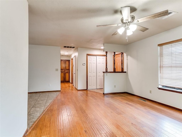 16687 SE 16th St, Choctaw, OK 73020 - unfurnished room with a ceiling fan, light wood finished floors, and baseboards