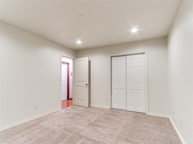 16687 SE 16th St, Choctaw, OK 73020 - unfurnished bedroom featuring light colored carpet, baseboards, recessed lighting, and a closet