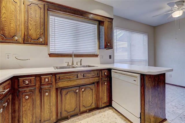 12217 Cork Rd, Oklahoma City, OK 73162 - kitchen with white dishwasher, a peninsula, ceiling fan, and light countertops