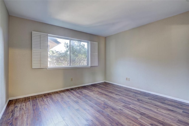 12217 Cork Rd, Oklahoma City, OK 73162 - empty room with wood finished floors and baseboards