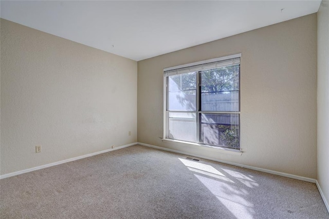 12217 Cork Rd, Oklahoma City, OK 73162 - carpeted spare room featuring baseboards