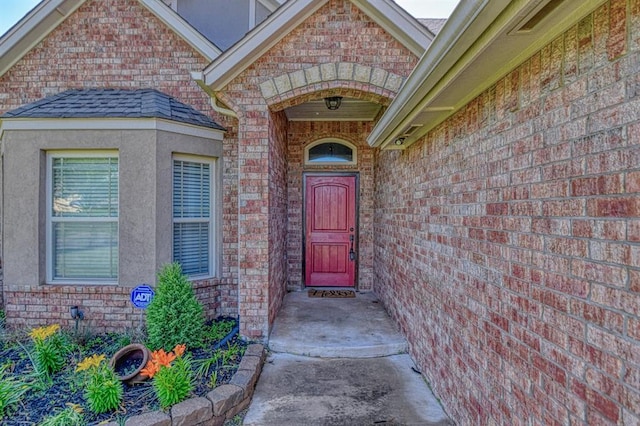 3024 Wakefield Rd, Edmond, OK 73034 - entrance to property featuring brick siding and roof with shingles