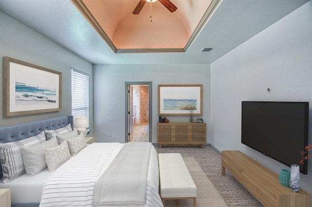 3024 Wakefield Rd, Edmond, OK 73034 - carpeted bedroom featuring a raised ceiling and ceiling fan