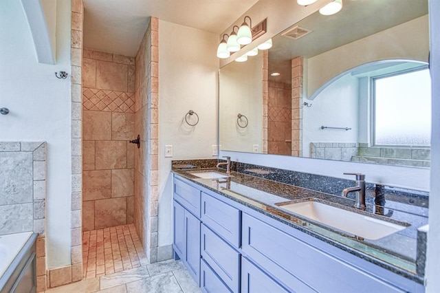 3024 Wakefield Rd, Edmond, OK 73034 - full bathroom with double vanity and a walk in shower