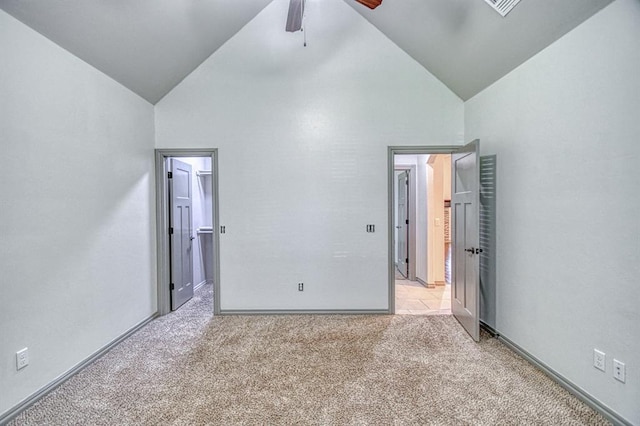 3024 Wakefield Rd, Edmond, OK 73034 - unfurnished bedroom featuring high vaulted ceiling, light carpet, a spacious closet, and a ceiling fan