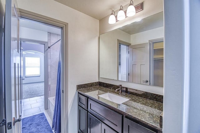 3024 Wakefield Rd, Edmond, OK 73034 - bathroom with vanity, shower / bath combo, and tile patterned flooring