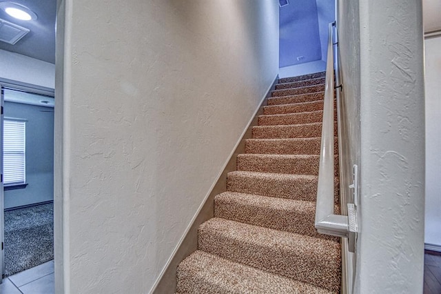 3024 Wakefield Rd, Edmond, OK 73034 - staircase featuring a textured wall